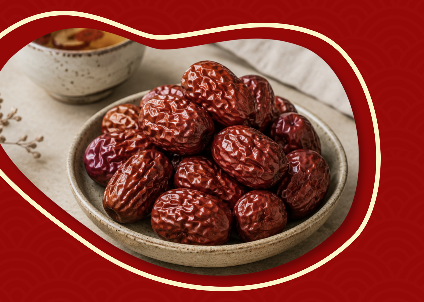 Dried Royal Jujubes in a ceramic bowl showing their wrinkled red date-like texture.